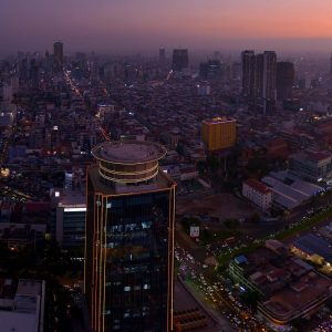 Stunning aerial view of Phnom Penh's cityscape at sunset, showcasing urban architecture.